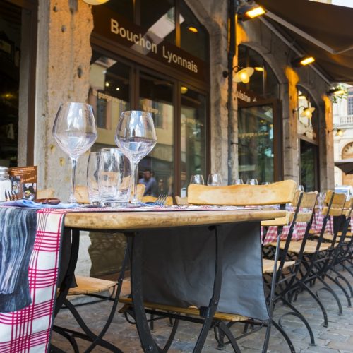 "Lyon, France - July 6, 2012: Empty outdoors of a Bouchon Lyonnais, a traditional restaurant which serves typical regional dishes."