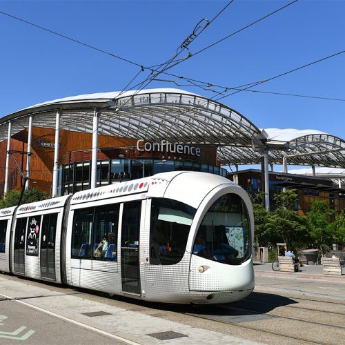 Lyon, France-06 25 2022: Tramway passing in front of the Confluence shopping center in the Confluence district of Lyon, France.