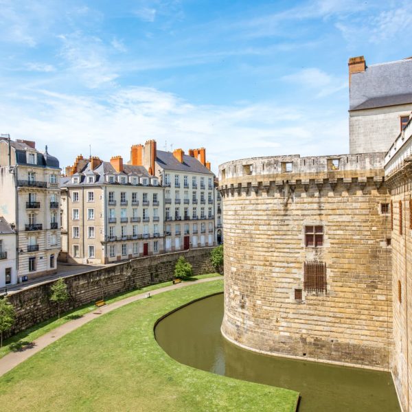 City scape view with castle wall and beautiful buildings in Nantes city during the sunny weather in France