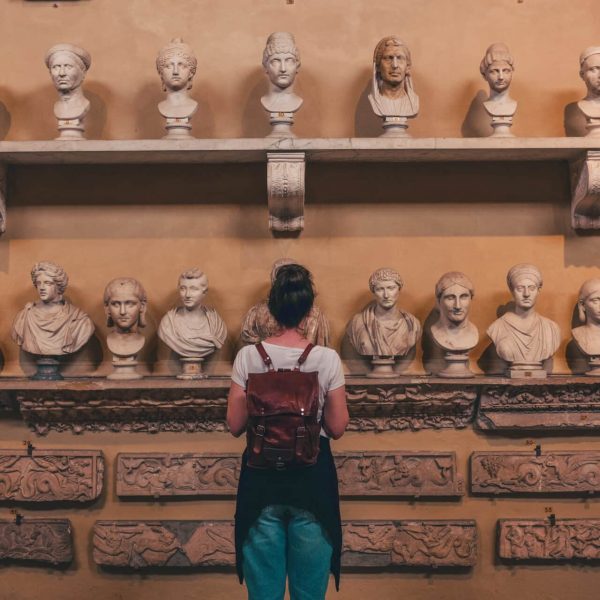 woman watching statues